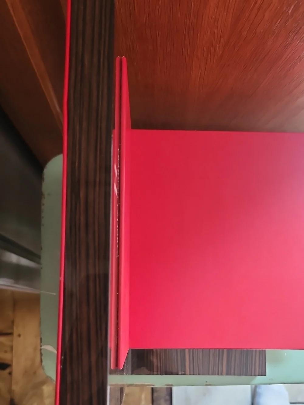Carolina Herrera Red and Wood Two-Tier Display